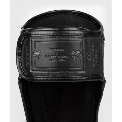 Venum S47 Shinguards Nero-Arancione